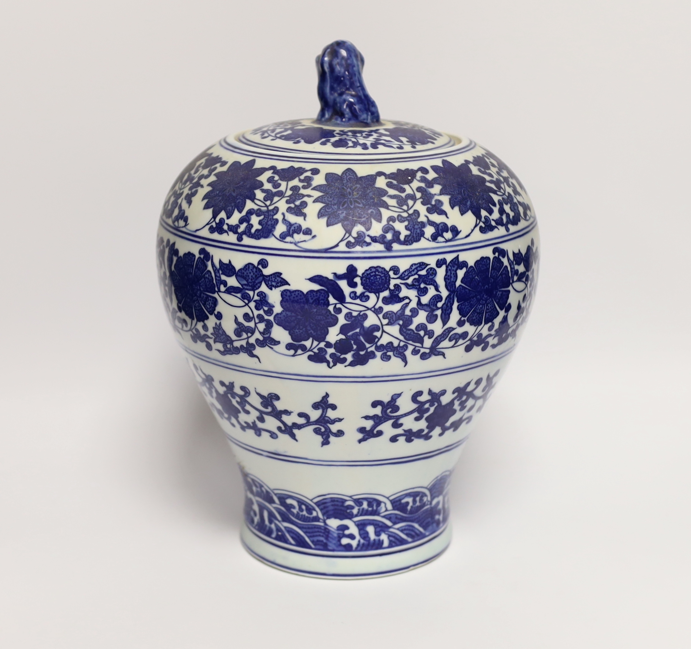 A Chinese blue and white floral vase and cover, 29cm high